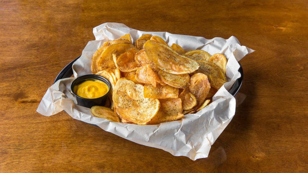 House Chips Basket · Homemade chips with our House Seasoning. Choice of two sauces: cheese, pepper relish, BBQ, chipotle mayo.