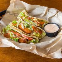 Fish Tacos · 3 flour tortillas full of succulent lightly battered white fish. Topped with lettuce, tomato...
