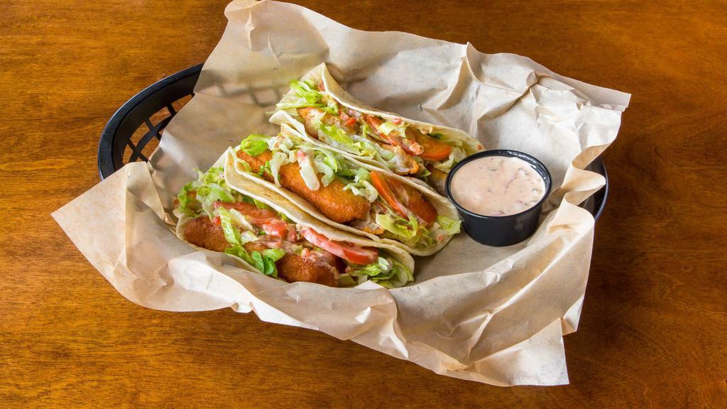 Fish Tacos · 3 flour tortillas full of succulent lightly battered white fish. Topped with lettuce, tomato, & our House Chipotle Pepper Relish
