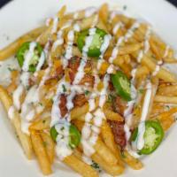 Loaded Cheese Fries · French Fries covered with melted cheddar and mozzarella topped with crispy bacon, jalapeños ...