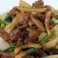 Mongolian Beef · Spicy. Sliced tender beef sauteed with green onion and onion in a hot spicy brown sauce, on ...