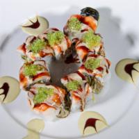 Green Turtle · Fresh water eel, avocado and tempura crunch topped with tiger shrimp and wasabi tobiko decor...