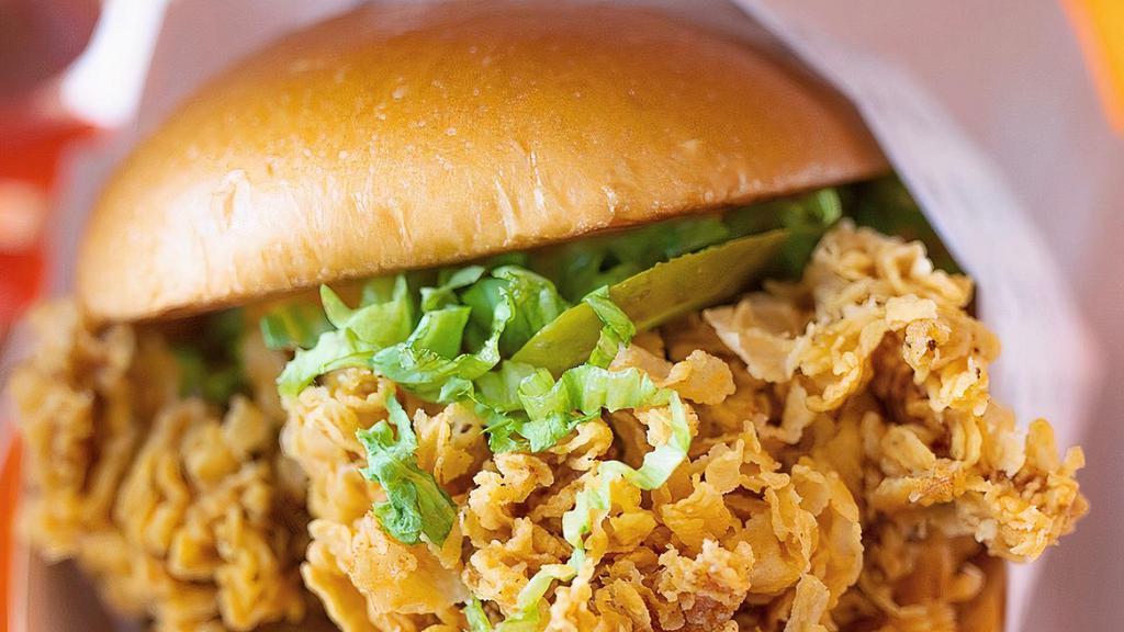 Chicken Sandwich © · Include one side and drink 
Comes with  lettuce , pickles , mayo