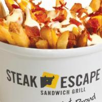 Totally Loaded Fries · Cal. 1220
Topped with bacon, cheddar, and our own ranch dressing.