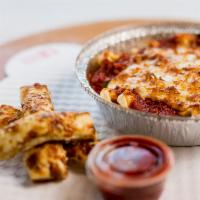 Baked Lasagna · Baked with your choice of homemade meat, tomato vegetarian or creamy alfredo sauce. Topped w...