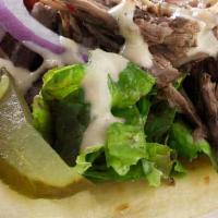 Bl Gyro Sandwich · Grilled beef and lamb with lettuce, tomato, and onion with tahini or cucumber sauce on pita ...