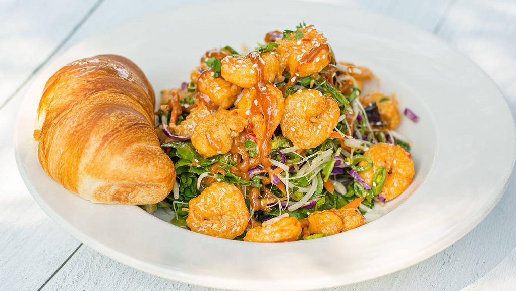 Dynamite Shrimp Salad · crispy shrimp tossed in a sweet and spicy cream sauce, mixed greens, carrot, cabbage, bean sprouts, green onion, sugar snap peas, cilantro, sesame ginger vinaigrette, peanut sauce, toasted sesame seeds