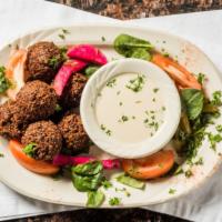 Falafel Plate · Chickpeas and fava beans ground with vegetable and spices. Served with tahini sauce.