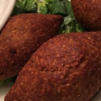 Fried Kibbeh · Sautéed lamb and onions stuffed in a kibbeh ball and fried in vegetable oil.