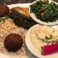 Veggie Combo · Tabbouli, hummus, grape leaves, falafel and spinach pie.