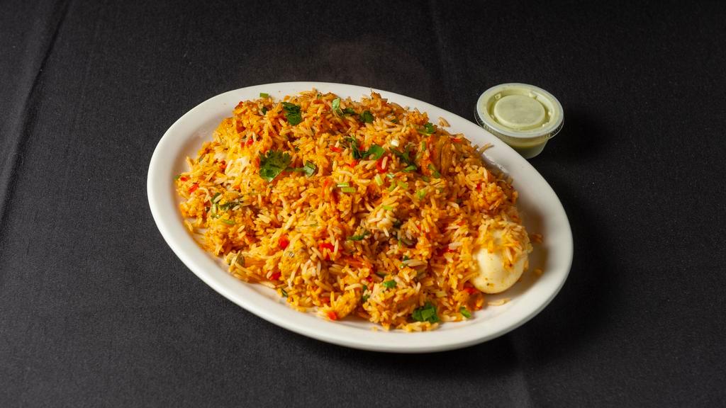 Chicken Biryani Or Chicken Fried Rice · Basmati rice and touch of curry sauce.