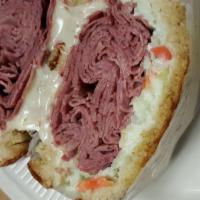 Mary'S Reuben Sandwich · Hot corned beef on an onion roll or grilled rye with swiss cheese, coleslaw and thousand isl...