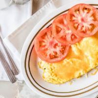 Western Omelette · Ham, cheese, tomatoes, onions and green peppers.