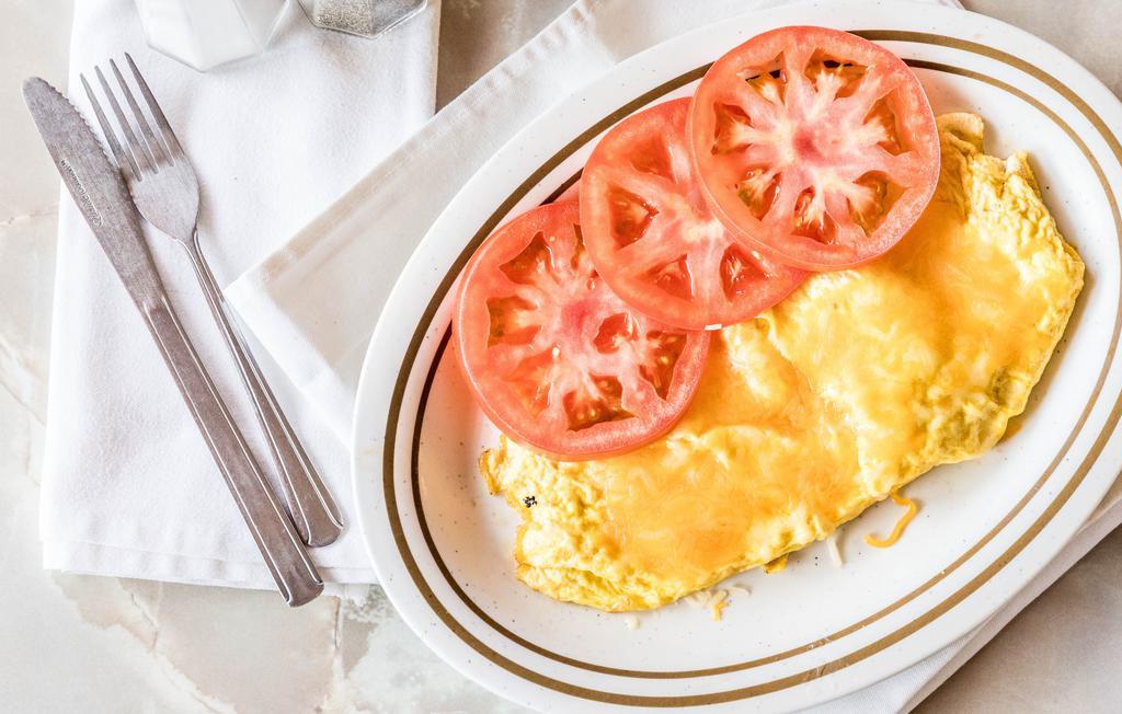 Western Omelette · Ham, cheese, tomatoes, onions and green peppers.