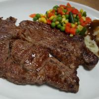 Ribeye Steak Dinner · Served with vegetable, mashed potatoes and gravy.