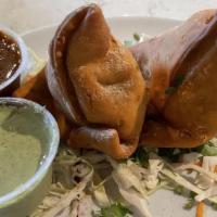 Veg Samosa · Vegan, vegetarian. Crispy pastry turnover, filled with potatoes, peas, spices, and herbs ser...