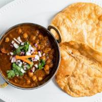Chole & Bhatura · Puffy fried white-flour bread spicy curried chickpeas.