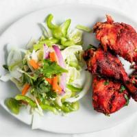 Tandoori Chicken · Gluten-free. Chicken marinated in yogurt with herbs and spices.