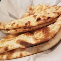 Butter Naan · Vegetarian. Bread baked in a clay oven and seasoned with butter.