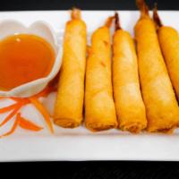 Shrimp Blanket · Marinated shrimp wrapped in spring roll paper and deep-fried. Served with sweet-sour sauce.