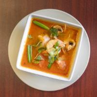 Tom Yum Soup · A vegetable broth with lemongrass, mushroom, tomato, onion, and cilantro.