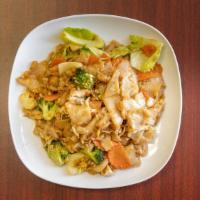 Pad See Eiw · Stir-fried flat rice noodles with egg, broccoli, carrot, and cabbage in Thai homemade sauce.