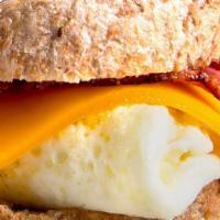 Breakfast Sandwich · 4 egg whites, turkey bacon, low-fat cheddar. Served on Ezekiel English muffin and side of fr...