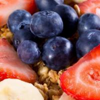 Ph Greek Yogurt · Greek yogurt topped with strawberries, blueberries, banana, granola, and honey.
