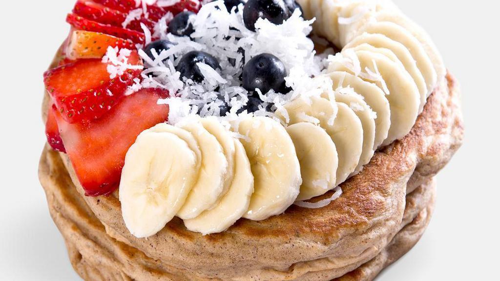 Mayra'S Vegan Protein Pancakes · Organic homemade pancakes topped with blueberries, strawberries, banana, and coconut. Vegan.