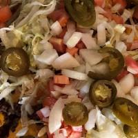 Nacho Platter · Ground beef, lettuce, tomato, nacho cheese, black olives, jalapeños and salsa.
