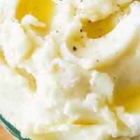 Mashed Potatoes Large  · Potatoes that have been mashed and mixed with milk butter and seasoning.