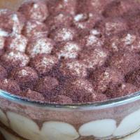 Tiramisu · Sponge cake soaked in espresso topped with mascarpone cream dusted with cocoa powder.
