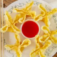 Crab Rangoon (6) · Fried sweet cream cheese with imitation crab meat, serving with sweet and sour sauce on the ...