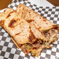 The Philly Wrap · Seasoned Philly beef, onions, green poppers, mushrooms, Swiss cheese, fusion sauce on toaste...