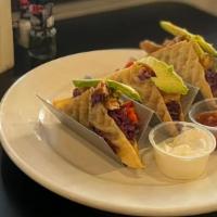 Wonton Tacos · grilled sirloin or seasoned chicken / red cabbage slaw / green onion / avocado / asian chili...