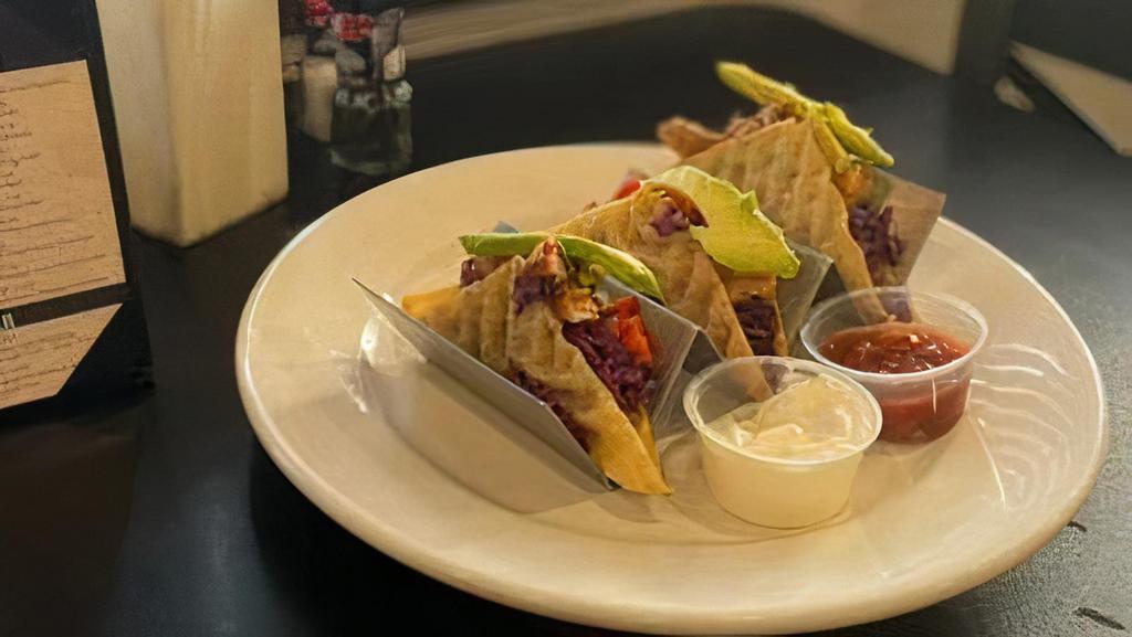 Wonton Tacos · grilled sirloin or seasoned chicken / red cabbage slaw / green onion / avocado / asian chili sauce