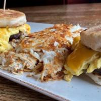 American Biscuits · Two biscuits with sausage patties, scrambled eggs and American cheese.  Served with hash bro...