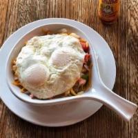 *American Skillet · Layered with diced potatoes, green peppers, onions, smoked sausage, American and Swiss chees...