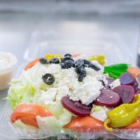 Greek Salad · Lettuce, Tomatoes, Red Onions, Green Peppers, Black Olives, Feta, Pepperoncini and Beets.