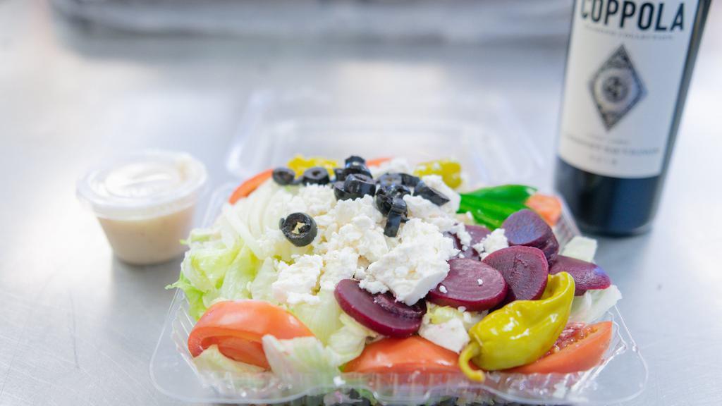 Greek Salad (Individual) · Lettuce, tomatoes, onions, green peppers, black olives, feta, pepperoncini and beets.