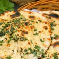 Onion Kulcha · Traditional indian bread stuffed with onions and baked in clay oven.