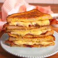 Grilled Cheese · Heavenly melted American cheese stuffed into two slices of bread.