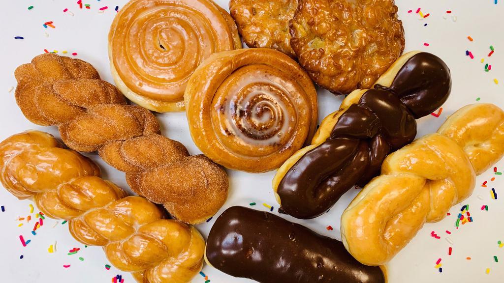 Trifecta Dozen · Assortment of four premium donuts, four fancy donuts, and five regular donuts!