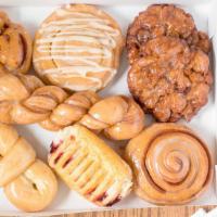 Dozen Fancy Donuts · An assortment of 12 donuts from a selection of our fancy options! Long Johns, bowties, bucke...