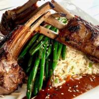 Korean Barbequed Lamb Chops · Three marinated and grilled, bone -in lamb chops with steamed basmati rice, sauteed green be...