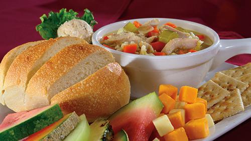 Peasant Lunch · A bowl of our hearty soup, a half loaf of freshly baked bread, assorted Wisconsin cheeses and seasonal fruit.
