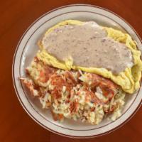 Southern Omelette · Eggs, sausage and American cheese, topped with country gravy. Hash browns inside.
