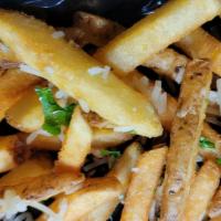 Truffle Fries · House fries nicely doused with white truffle oil then garnished with parmesan cheese and par...