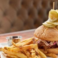 Pulled Pork Sandwich · Hand pulled hardwood-smoked pork shoulder, BBQ sauce, cider mustard, coleslaw, spicy bread a...