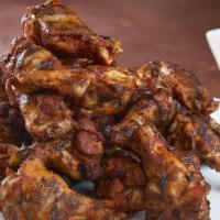 30 Smoked Wings · 30 Grilled chili-rubbed jumbo wings and drummies, BBQ sauce, Carolina mustard BBQ sauce, oli...